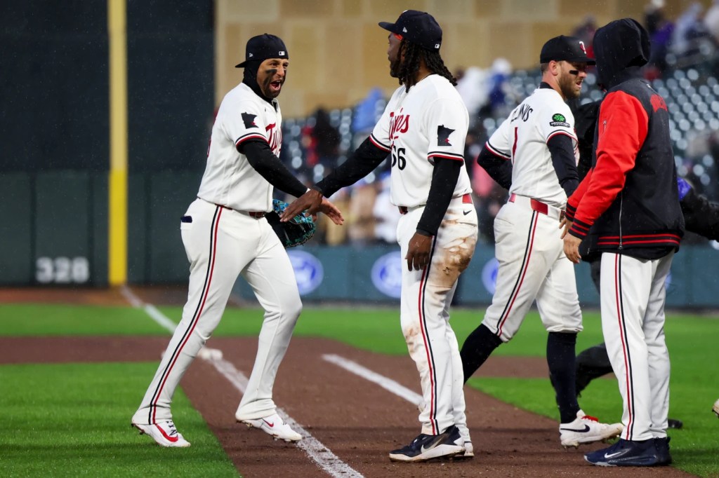 Twins endure a pregame power outage on a cold, rainy day to make for a happy home opener