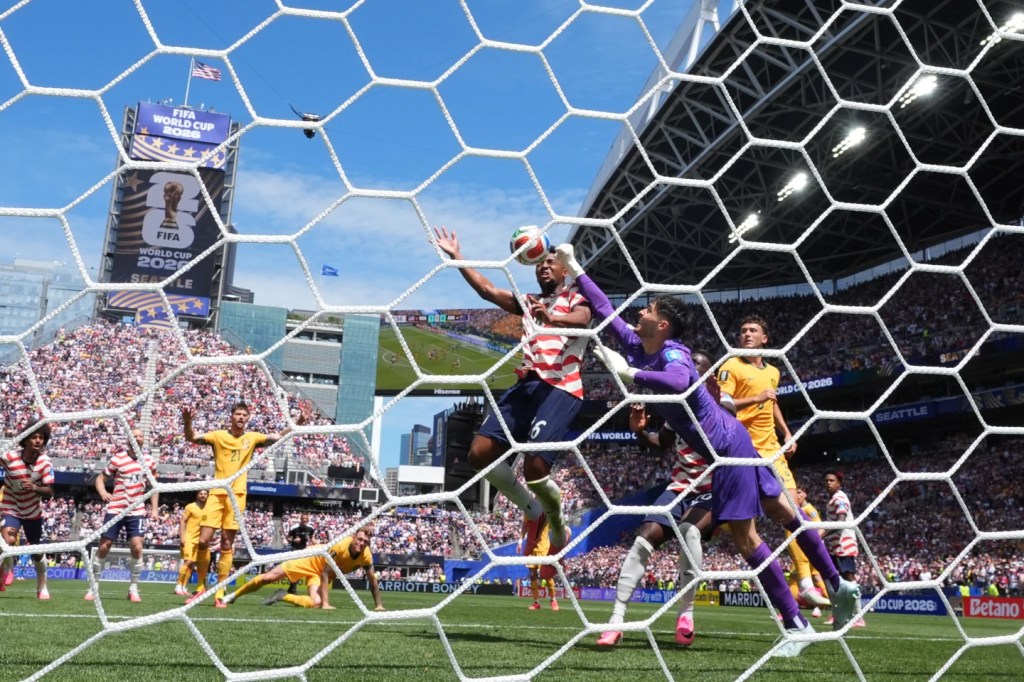 US reaches World Cup knockout round and wins its group with 2nd straight victory, 2-0 over Australia